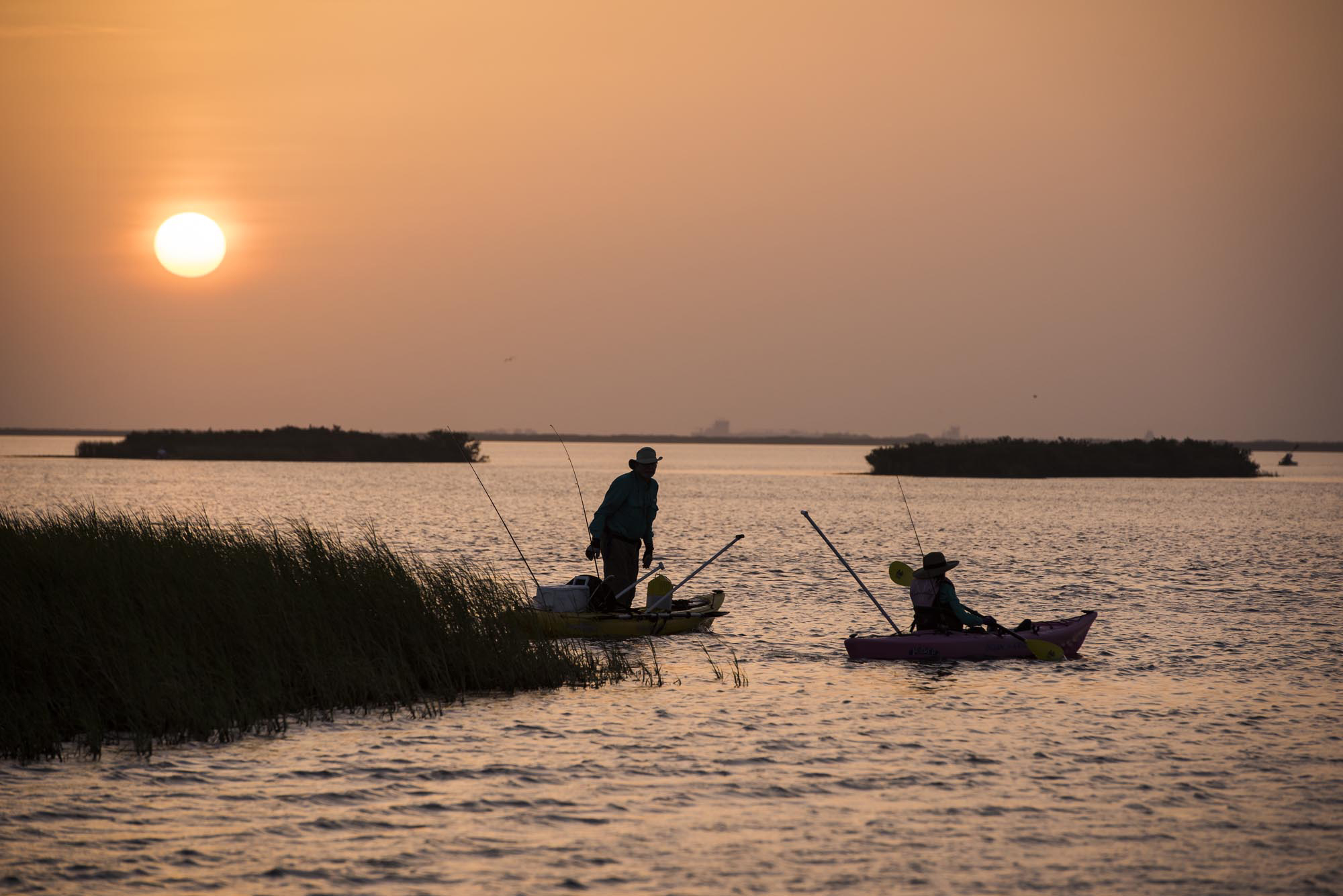 Anglers fishing on kayaks in Texas, near Port Aransas. Copyright Texas Parks and Wildlife
